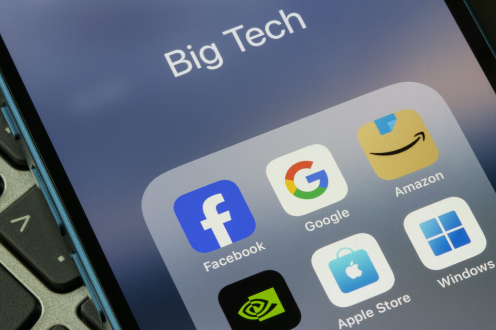 Portland, OR, USA - Oct 19, 2024: App icons representing big tech companies including Meta Platforms, Alphabet Inc., Amazon.com, Nvidia, Apple Inc., and Microsoft Corporation are seen on an iPhone.