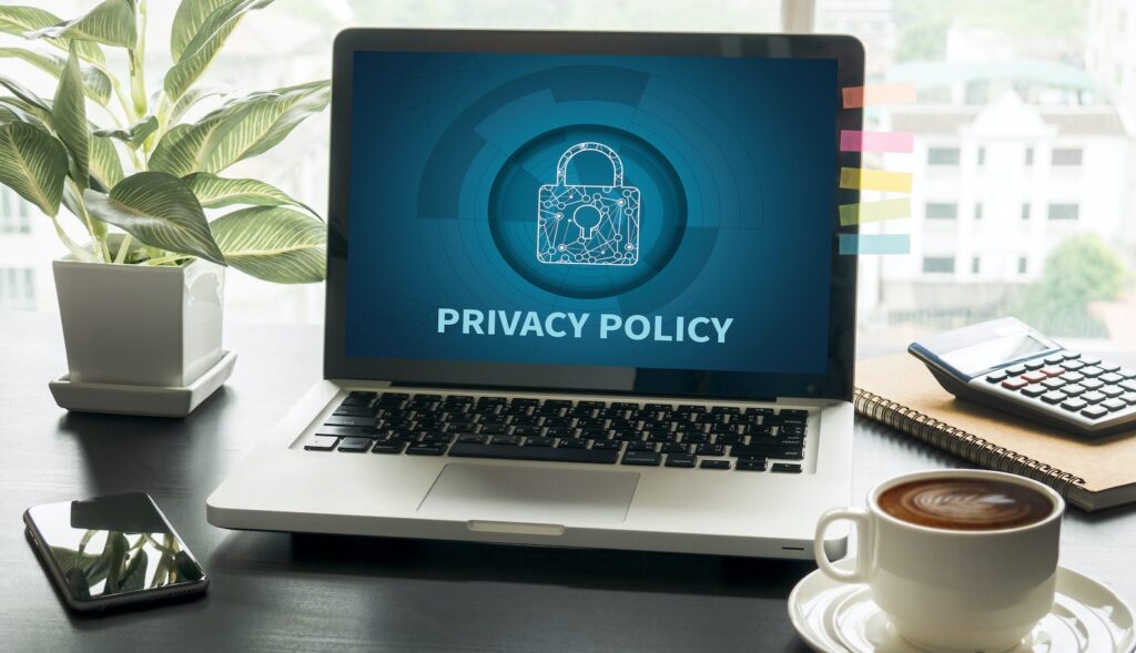 Privacy policy written on a laptop screen on desk