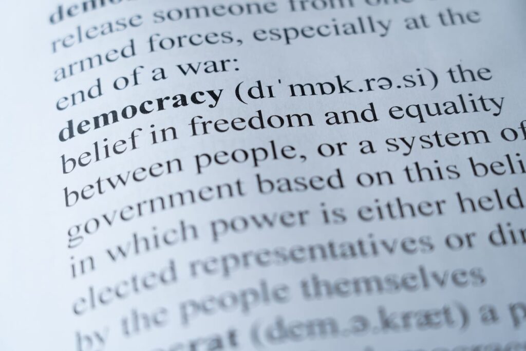 Dictionary page showing the word Democracy with definition